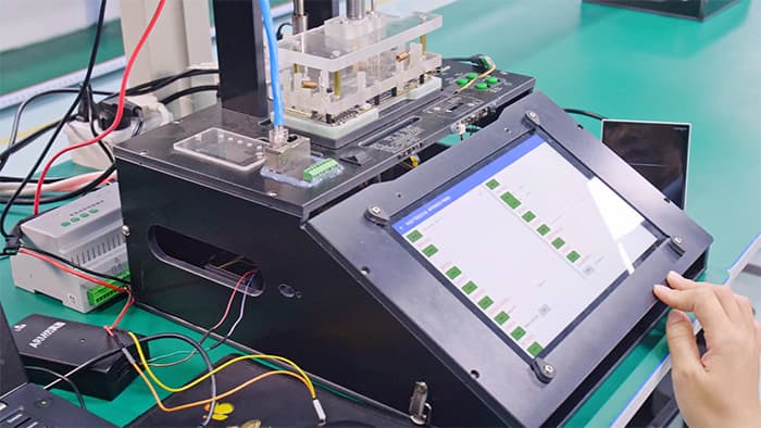 Engineer validating a replacement electronic component on a PCB test bench